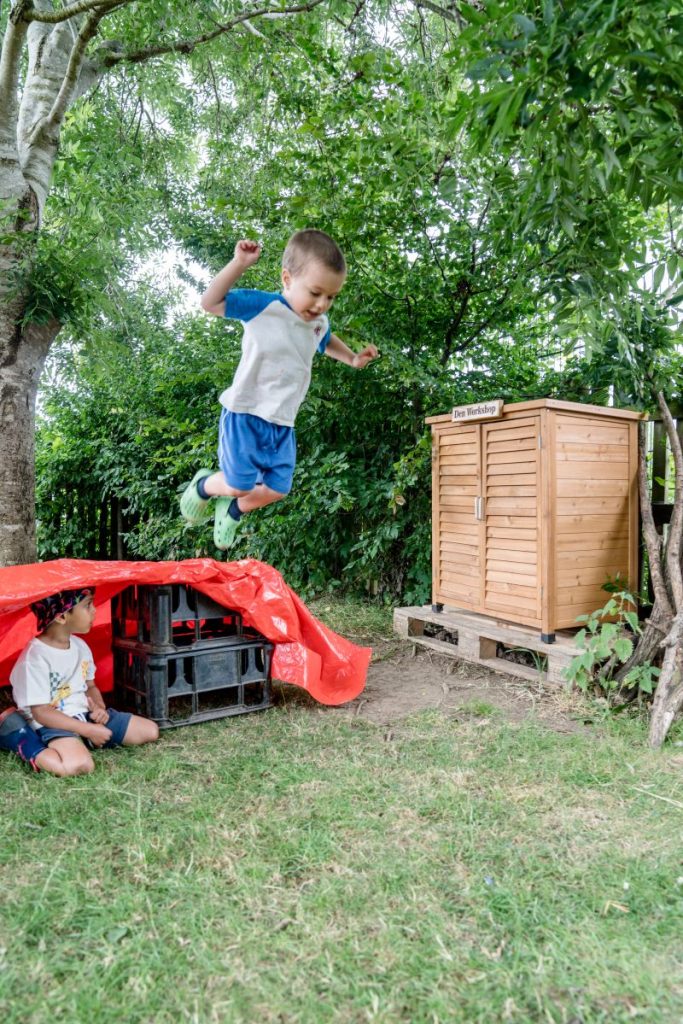 children making  dens in the garden in rugby