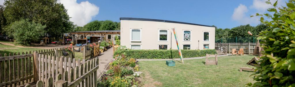 blue ‌windmill nursery in rugby landscape